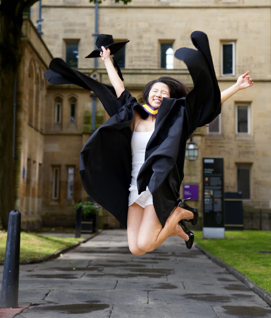 Graduate Jumping for joy